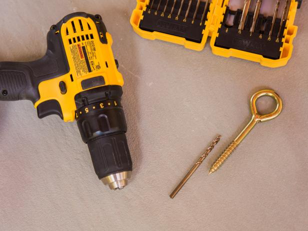 Step 2- Prep for Eye Bolts Pull your measuring tape across the middle of the swing to get an average width then make two marks that many inches apart along the joist with a pencil . Drill pilot holes using a drill bit thinner than the thickness of your eyebolt in preparation for installation PRO TIP- Never use a drill bit as thick as your eye bolt, as it will render the swing UNSAFE.
