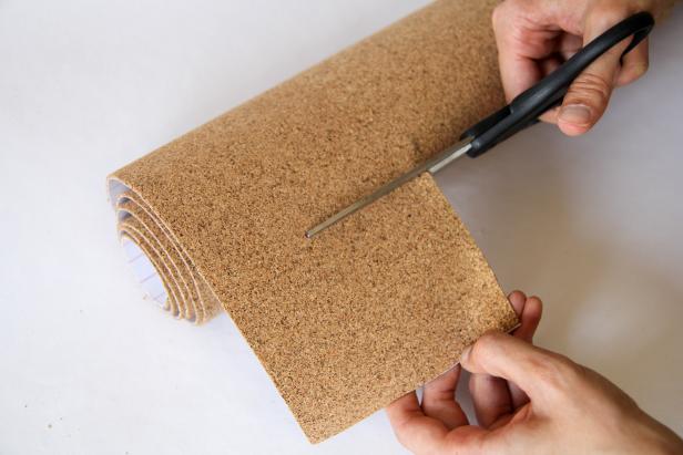 Cut a square out of a sheet of adhesive cork roll to place on the back of coaster.