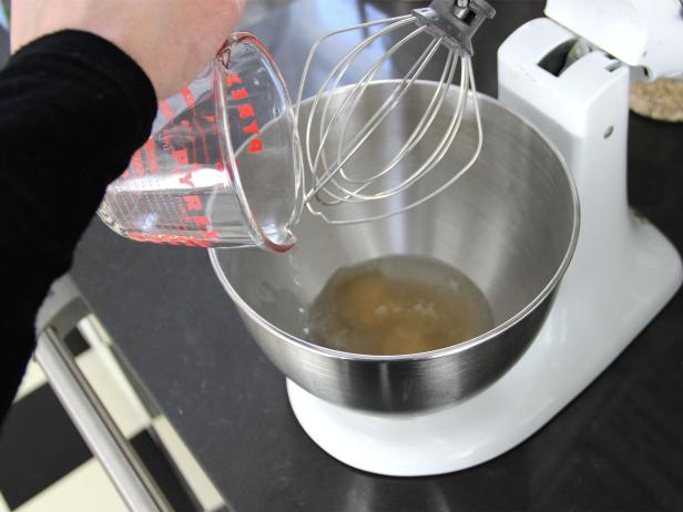 Add Water pouring water into mixing bowl