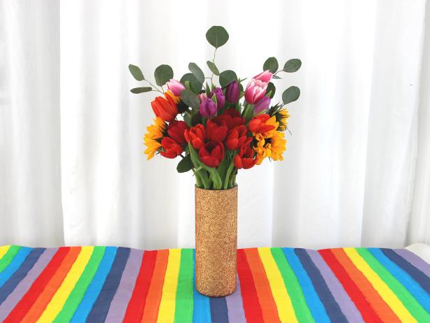 Fill in the grid with rainbow colored flowers and greenery.