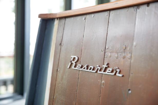 The boat logo was reinstalled horizontally on the side of the breakfast nook banquette seating to leave no doubt that the banquette has an interesting history and past life.