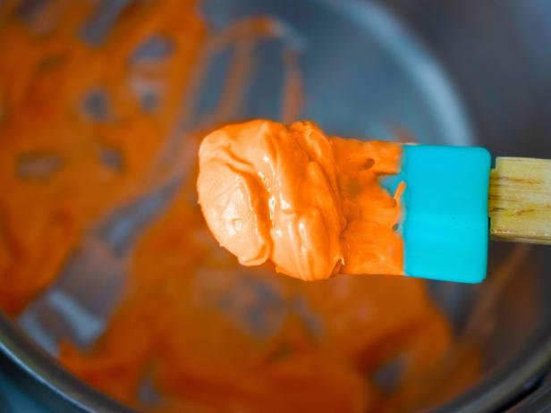 How to Make Easter Bunny-Approved Carrot Treats DIY crispy carrots covered in orange-colored chocolate.