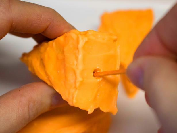 How to Make Easter Bunny-Approved Carrot Treats DIY crispy carrots covered in orange-colored chocolate.