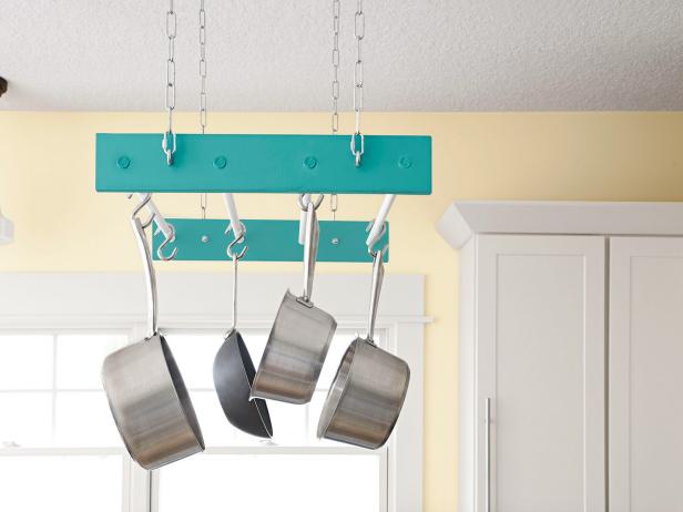 Pots and Pans Hanging From Blue Rack Pots and Pans Hanging From Blue Rack