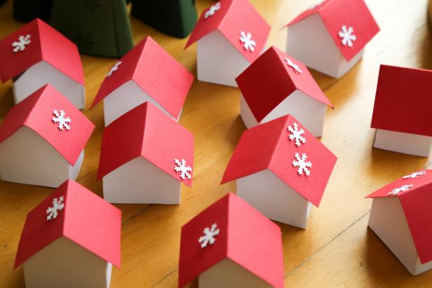 Snowy Rooftops in the Paper Advent Village Paper snowflakes are added to the houses' rooftops.