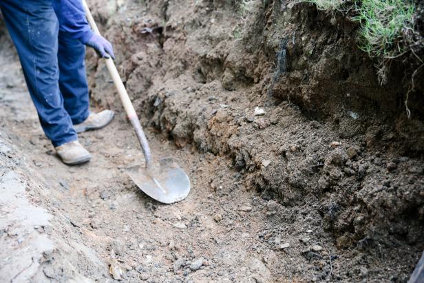 Photo Showing Plate Tamp Compacting Soil