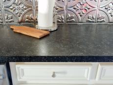Freshen up a worn or dated-looking countertop with paint. The secret is to take your time and use the right materials to produce durable results that are beautiful and much less expensive than a total replacement.
