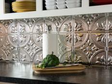 Give your kitchen a stunning, stylish upgrade with metallic-finish tiles. This DIY project requires just a few standard tools and not a lot of money.
