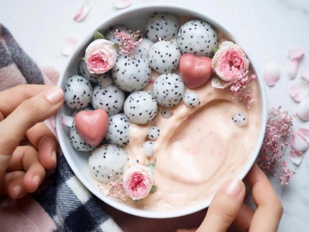 Bowl With Yogurt Edible Flowers and Dragon Fruit Spheres
