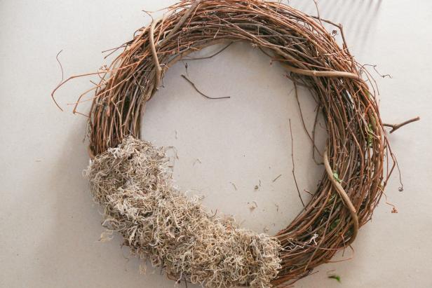 Attach Moss to the Fairy Garden Wreath Sphagnum moss is attached to the wreath.