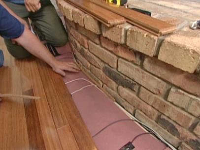 To Install Flooring Around A Fireplace, How To Lay Laminate Flooring Against An Uneven Wall