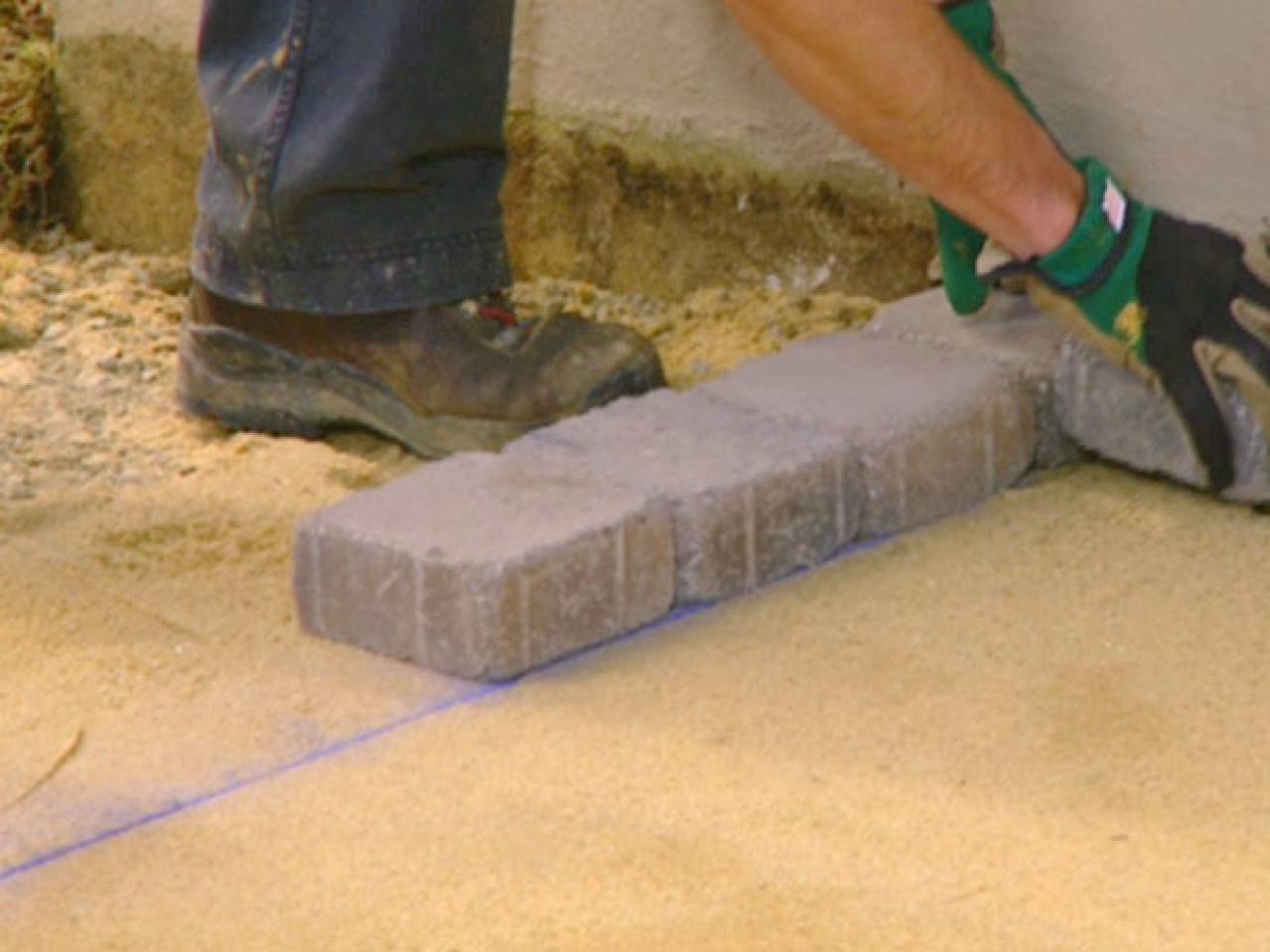 how to lay patio stones on sand