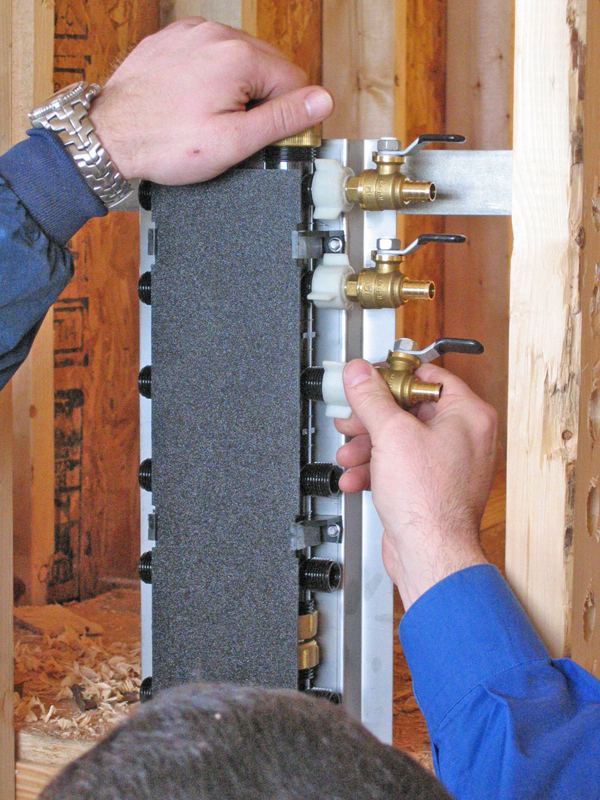 plumbing hardware to secure pipes to wall
