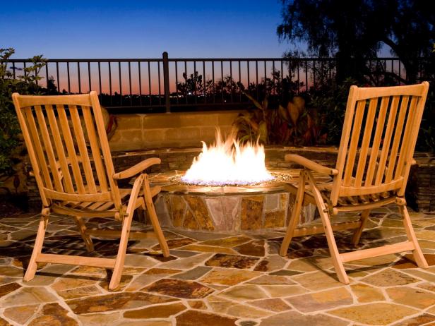 Wooden Deck Chairs And Stone Fire Pit