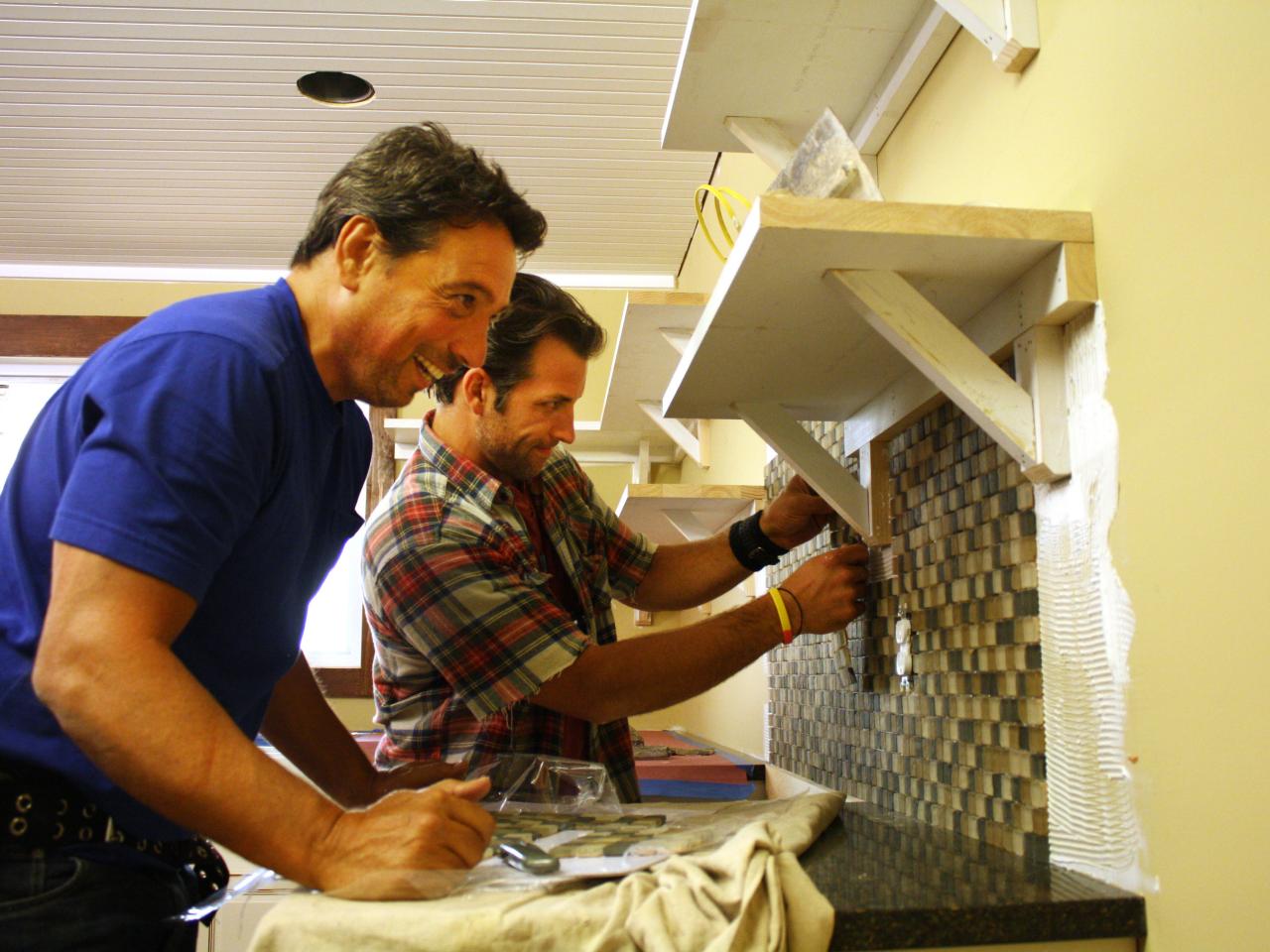 John DeSilvia and Marc Bartolomeo install a glass