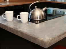 Concrete countertop with teapot on a range