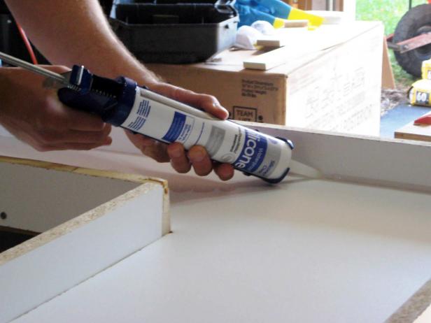 Run a small uniform bead of 100-percent silicone caulk in all the inside corners and seams of the mold. Smooth the bead with a caulk tool or your finger and let dry thoroughly for 24 hours.