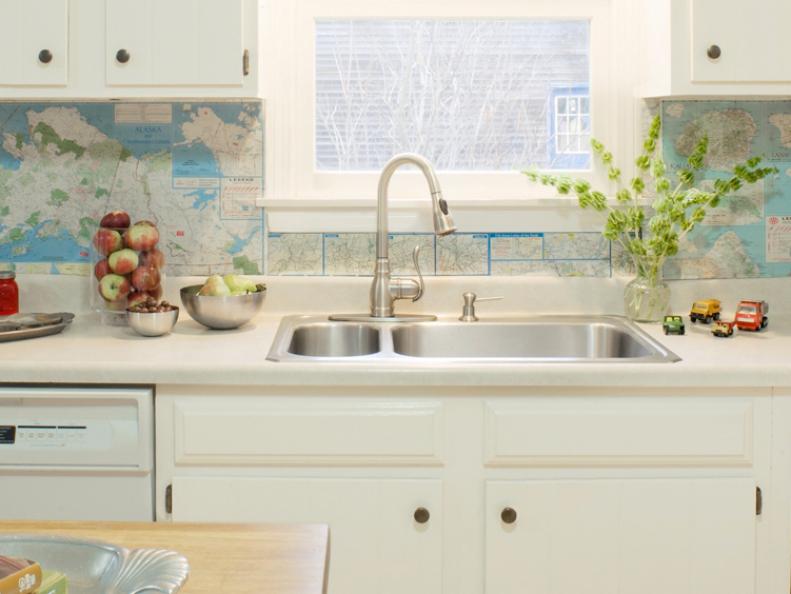 White Kitchen With Map Covered Backsplash
