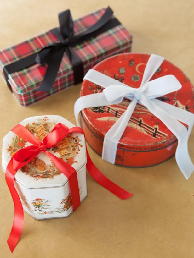 Different types of Christmas cookie tin wrapping aranged in a photo.