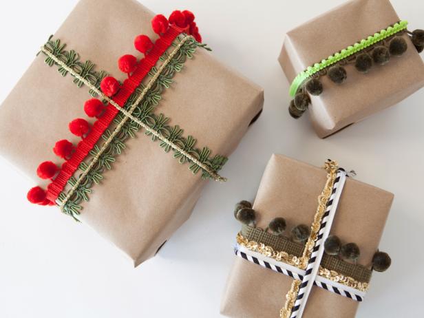 Different types of Christmas wrapping made with fabric embellishments aranged in a photo.