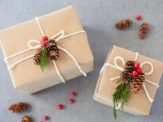 Different types of Christmas wrapping decorated with nature pine cones aranged in a photo.