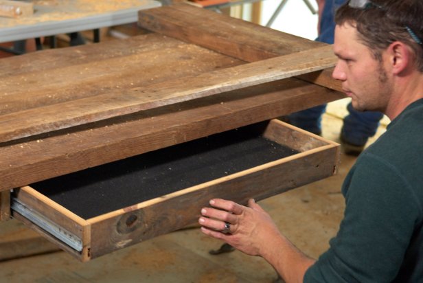 Add more storage to your desk by making a desk drawer. Approximately 16' of reclaimed 1x4 will be needed to create a 24&quot; x 12&quot; drawer. Cut two pieces at 22.5&quot; and two pieces at 12&quot;. Cut one piece of 1/2&quot; plywood to 22.5&quot; x 10.5&quot;. Fasten the box sides to the drawer bottom with wood glue and 15-gauge finish nails. Next, cut one piece at 28&quot;. Add wood glue and finish nail to the front of the box with the overhang equal on each side.
