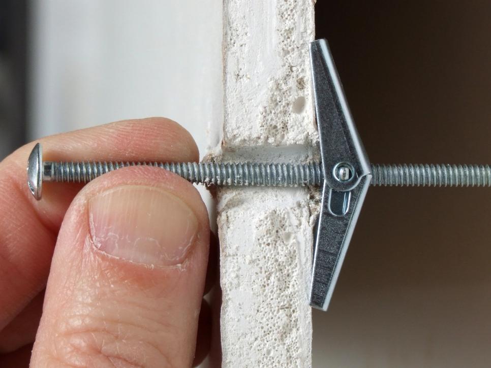 How To Use Metal Drywall Anchors - It has a spiked collar to drill inside the walls use brackets to have a firm grip, and you are ready to hang things on the wall.