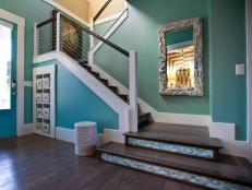 Introducing the home's sea-inspired color palette and High Regency design focus, the foyer celebrates Jacksonville Beach history and showcases locally sourced building materials.
