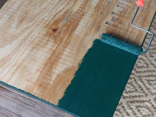 After determining the proper height and width for your string art piece, have a sheet of 3/4â   paint-grade plywood cut to size at the local home improvement store. Lay the plywood down on a flat, level surface on top of the drop cloth. Paint the front and the sides of the plywood with the colored latex paint.