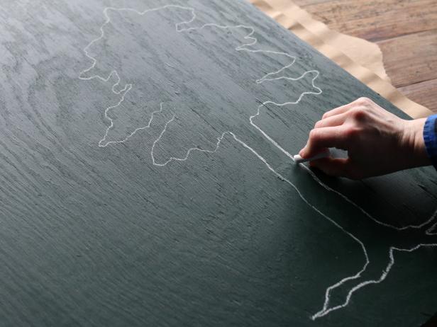 Use chalk to trace the silhouette of your graphic shape directly to the painted plywood.