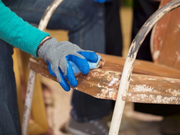 Once the surface is smooth and even, wipe it down with a solvent like acetone to ensure the chair is clean and ready for priming and painting.