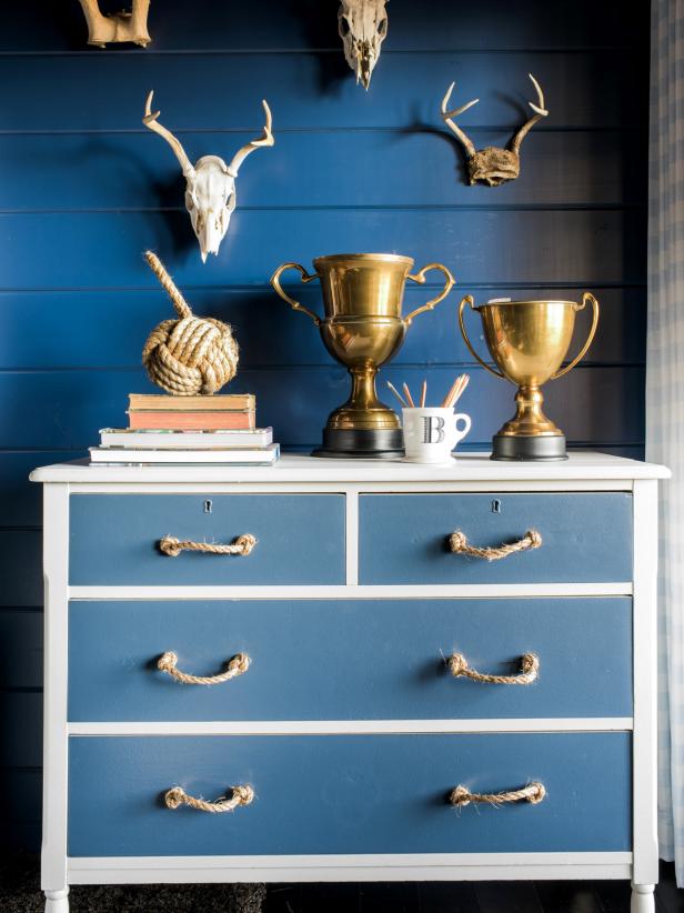 Using two shades of paint and a roll of sisal rope, transform a humdrum wooden dresser into a masculine masterpiece for a boyâ  s room.