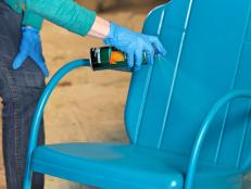 Even with rust inhibiting spray paint, a clear coat is a smart idea. Look for a clear oil-based urethane thatâ  s for outdoor use, preferably with UV protection to help prevent fading. Hold the can 10-12â   away and spray using a back and forth motion. Follow the natural lines of the chair to coat it evenly. For a smooth finish, lightly sand between coats with 200 grit or higher sandpaper.
