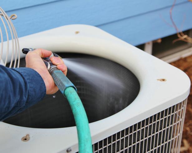 A strong spray from a garden hose will push debris from the inside of the condenser unit out.