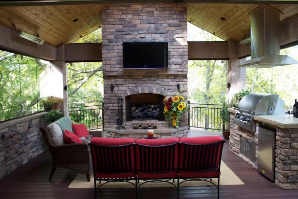 Rooftop Outdoor Kitchen Elegant stone fireplace with outdoor kitchen