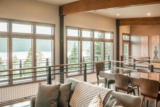 Wall to wall windows showcase spectacular views of Lake Coeur d’Alene upon entering the home.