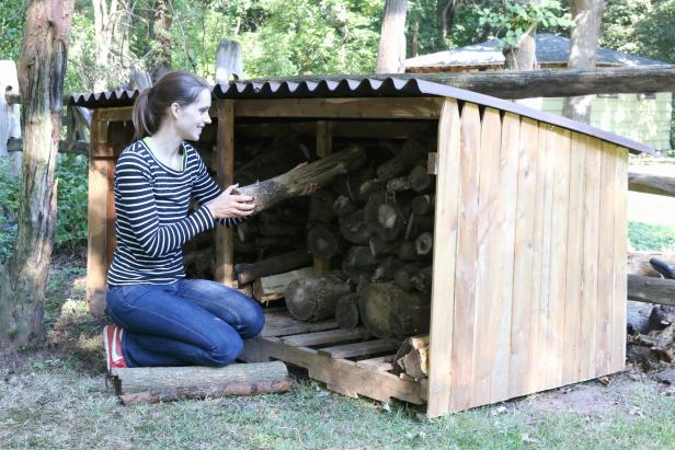 Learn how to build an outdoor firewood shelter to keep logs dry.