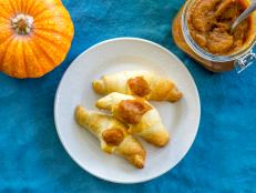 plate with three croissants and pumpkin butter
