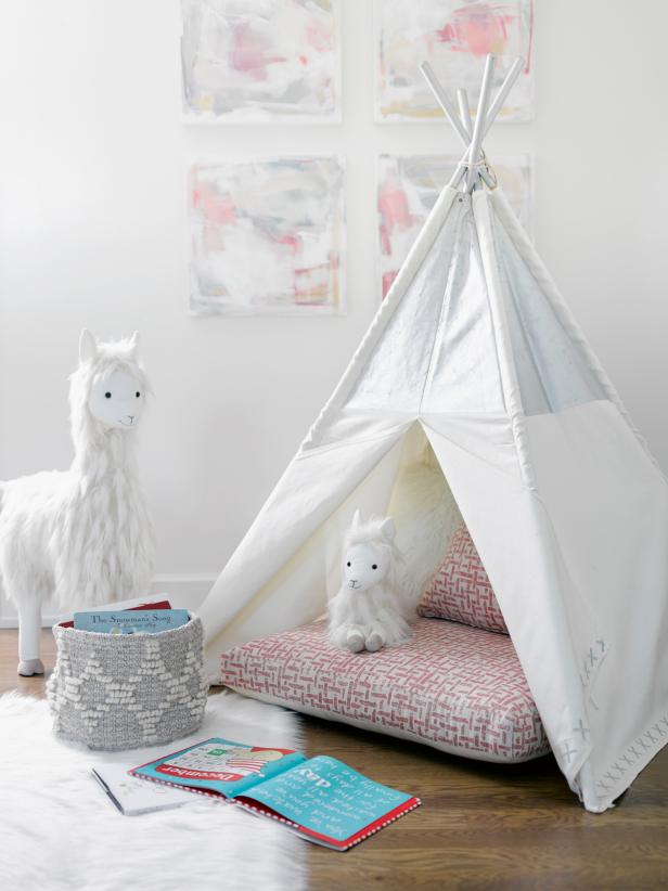 Pastels and teepee in beautiful pink and white corner of kids room