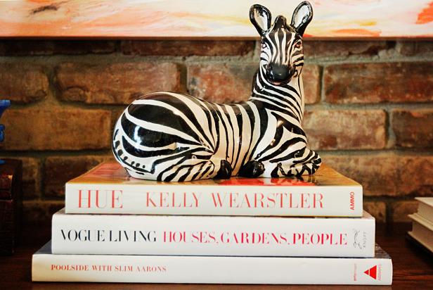 Console Table with Zebra Sculpture and Books