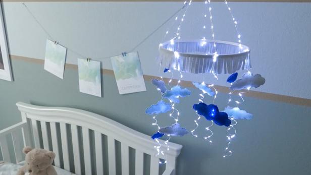 A DIY sparkly cloud mobile brings a special effect to the nursery. It will light up the room and the soft, felt clouds drift gently above, as your baby falls asleep.
