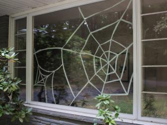 DIY cardboard spider web display for the window.
