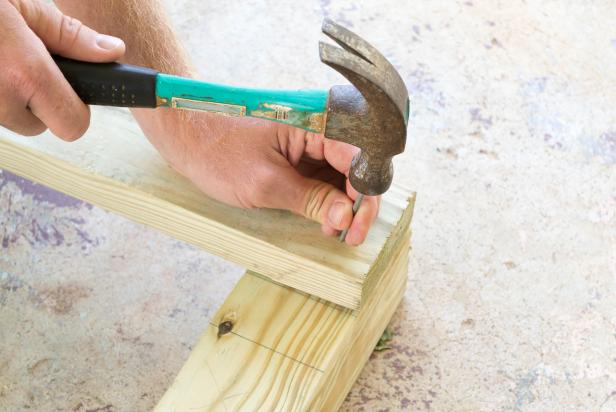 hammering a nail into wood