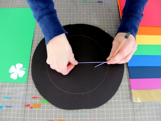 Shorten the length of the string to four inches and then draw a smaller circle.
