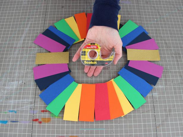 Lay out the paper strips in a rainbow arrangement to determine the correct spacing.