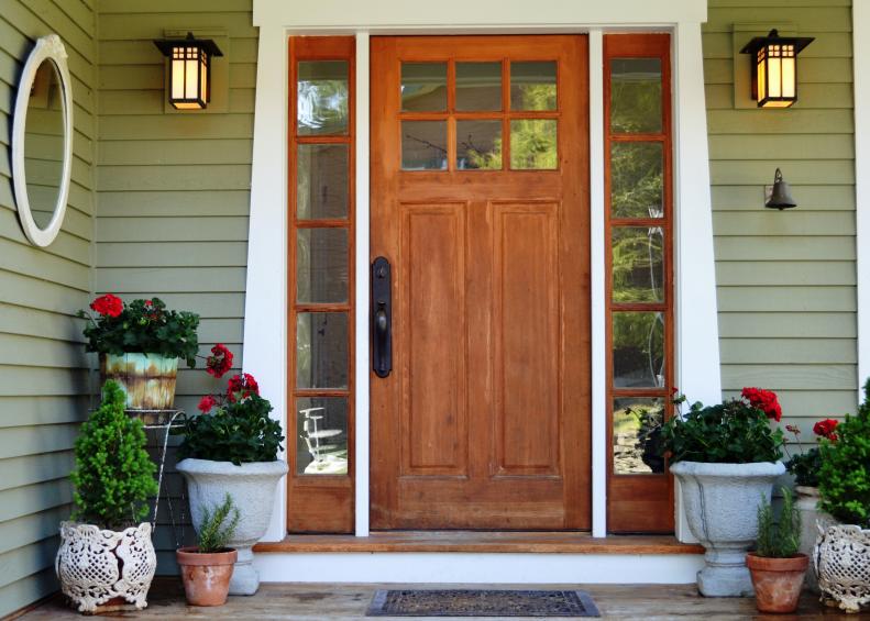 Craftsman Style Front Door With Geranium Planters