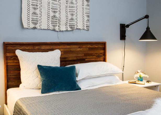 Use screws to attach the leather belt headboard to the wall.