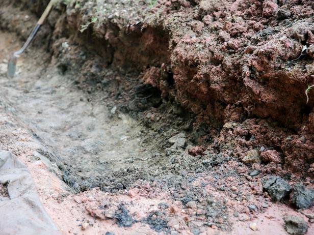 How To Build A Boulder Retaining Wall | How-tos | DIY