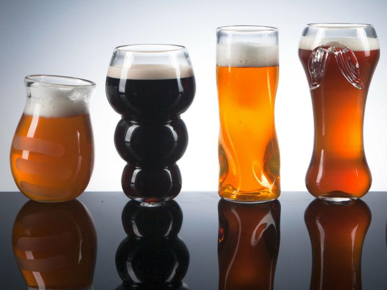 Row of Glass Beer Glasses in Various Shapes and Sizes