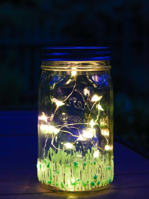 The light sits on a table outside in the evening.